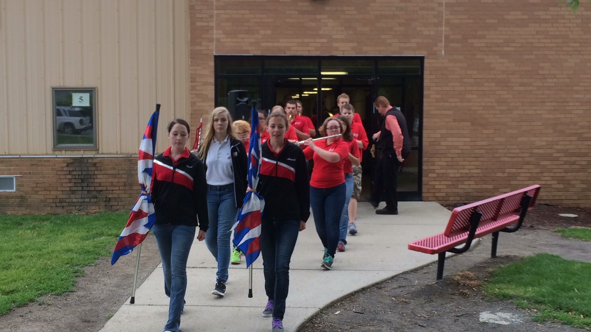 Band students leading the elementary to the new flag pole
